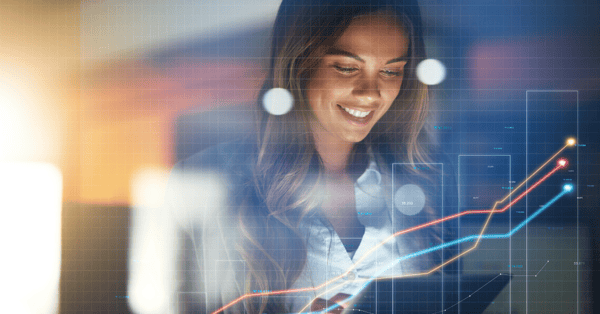 Woman analysing data, smiling at her tablet, with a line chart infographic overlayed