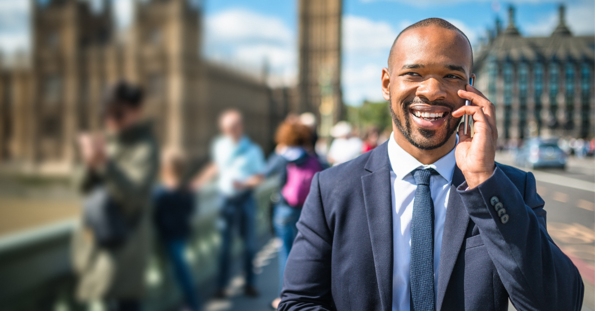 Male politican on phone with London backdrop-1